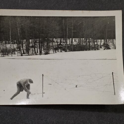 20260923_143316 WWII German Wehrmacht Soldier Cutting Stick Grenade From Barbed Wire Photo